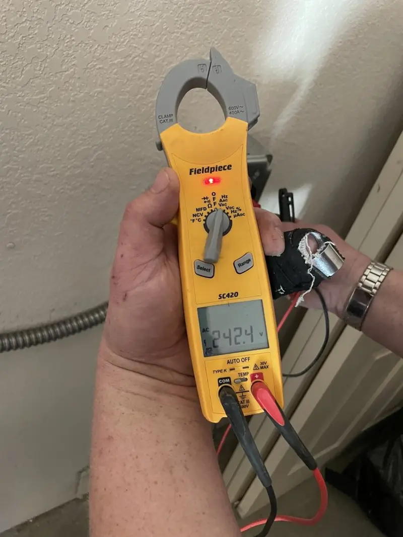 Voltage testing with clamp meter during Circuit Breaker Repair in Guttenberg